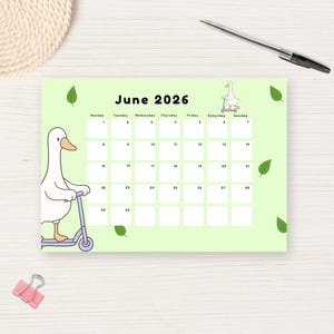 May include: A light green calendar for June 2026 with a cartoon goose riding a scooter. The calendar has a simple layout with dates and days of the week. Decorative green leaves are scattered around the calendar.