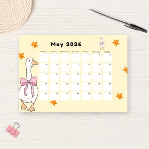 May include: A light yellow May 2026 calendar with a cartoon goose wearing a pink bow. The calendar has a grid layout with dates and days of the week. Orange leaf illustrations are scattered around the edges.