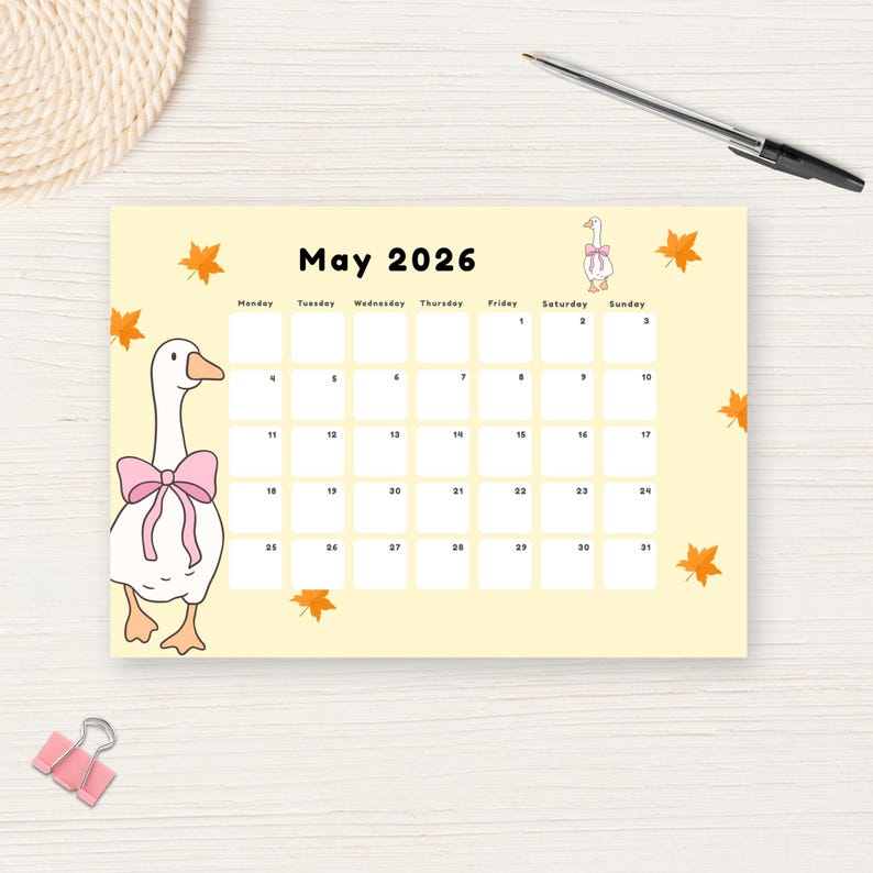 May include: A light yellow May 2026 calendar with a cartoon goose wearing a pink bow. The calendar has a grid layout with dates and days of the week. Orange leaf illustrations are scattered around the edges.