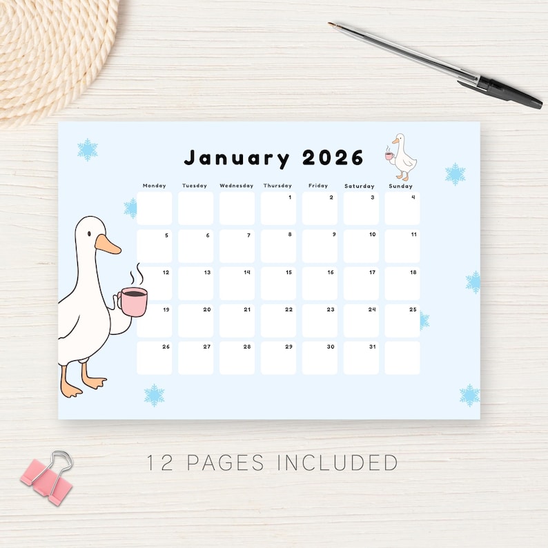 May include: A light blue 2026 calendar with a cartoon goose illustration. The calendar features the month of January with dates and days of the week. The text "12 PAGES INCLUDED" is at the bottom. A pen and paper clip are also visible.