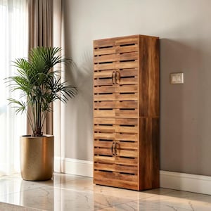 May include: A tall, wooden cabinet with a slatted design. The cabinet is made of a warm-toned wood and features two sets of double doors with small, dark metal handles. A potted plant in a gold-colored pot sits nearby.