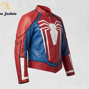 May include: A red and blue leather jacket featuring a prominent white spider emblem on the chest. The jacket has a mandarin collar, a front zipper closure, and white accents on the sleeves. The text Stitchure Jackets appears in the top left corner.