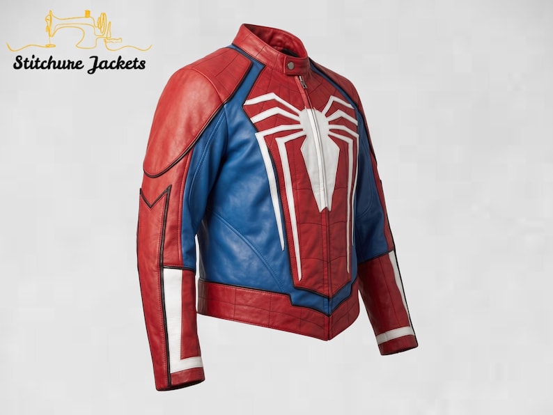 May include: A red and blue leather jacket featuring a prominent white spider emblem on the chest. The jacket has a mandarin collar, a front zipper closure, and white accents on the sleeves. The text Stitchure Jackets appears in the top left corner.