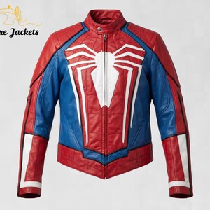 May include: A red and blue leather jacket featuring a large white spider emblem on the chest, a stand-up collar with a snap button, and a full-length front zipper. The design includes quilted paneling and white accents on the sleeves and torso.