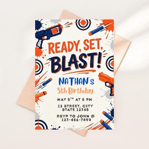 May include: A birthday invitation with a white background, featuring orange and blue graphics of toy guns, targets, and darts. The text "READY, SET, BLAST!" is prominently displayed, along with details for Nathan's 5th birthday, including date, time, and RSVP information.