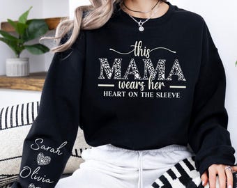 Custom This Mama Wears Her Heart On Her Sleeve Hoodie, Personalized Mom Sweatshirt With Kids Names, Cute Momma Outfit, Mothers Day Gifts