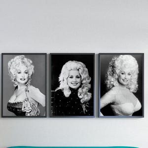 May include: Three framed black and white portraits of a woman with blonde hair hang above a teal sofa. A Christmas tree with silver and gold ornaments stands to the left. A glass-topped table holds candles and decorative trees.