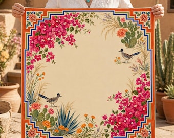 May include: A square scarf featuring a cream-colored center framed by a vibrant border of pink bougainvillea, green cacti, orange flowers, and two roadrunner birds. The design is enclosed within a geometric orange and blue patterned frame.