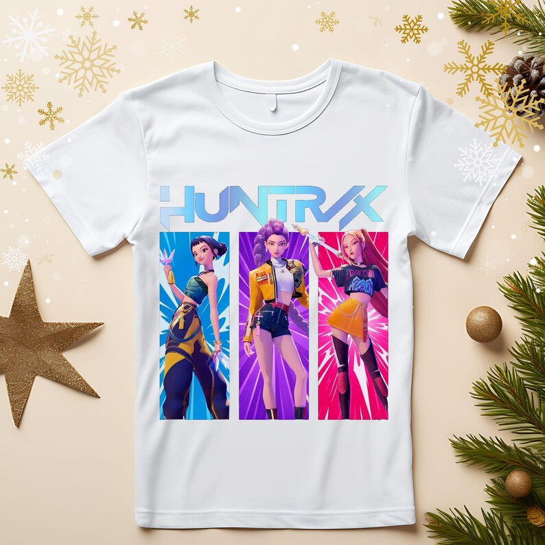 A product mockup showing a vibrant Huntrix Kpop Demon Hunters graphic applied to a physical item. The print highlights the vivid colors and crisp details of the Saja Girls anime PNG design, demonstrating its perfect application for sublimation and DTG printing.