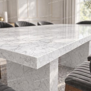 May include: A rectangular dining table featuring a white marble top with grey veining and a matching thick marble pedestal base. The table is surrounded by several dark grey upholstered chairs with vertical channel tufting on the backrests.