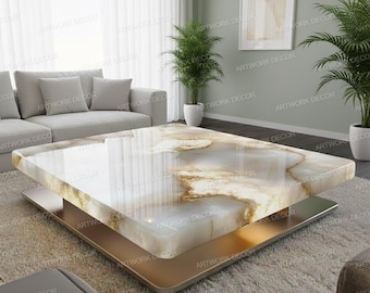 May include: A modern square coffee table with a white and gold marble top. The table has a gold-colored base and a silver-colored support. The table is in a living room setting with a gray sofa and plants.