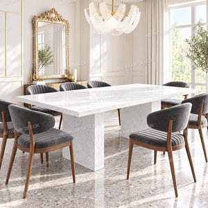 May include: A rectangular dining table with a white marble top and a matching pedestal base, surrounded by six chairs featuring dark gray upholstered seats with vertical channel tufting and curved wooden frames with tapered legs.