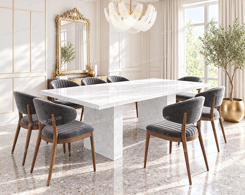 May include: A rectangular dining table with a white marble top and a matching pedestal base, surrounded by six chairs featuring dark gray upholstered seats with vertical channel tufting and curved wooden frames with tapered legs.