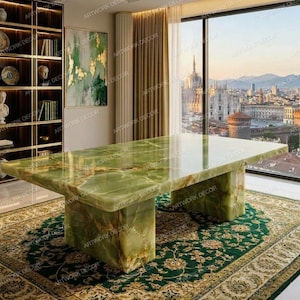 May include: A large rectangular dining table crafted from polished green onyx stone with natural white and gold veining. The table features a thick, smooth tabletop surface supported by two substantial, matching green onyx block-style pedestals.