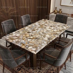 May include: A rectangular dining table featuring a tabletop composed of numerous polished, multi-toned agate slices in shades of brown, gray, and cream, supported by a dark base, surrounded by six dark gray upholstered chairs with wooden frames.