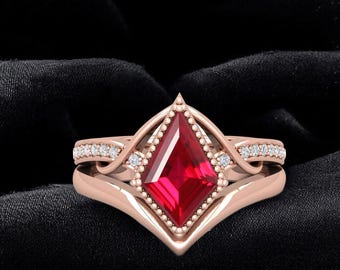 May include: A rose gold ring set featuring a vibrant red, square-cut gemstone as the focal point. The ring is accented with small, sparkling diamonds and a delicate beaded border, set against a black background.
