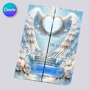 Può includere: Biglietto commemorativo con cornice a forma di cuore, ali d'angelo e la scritta "In Loving Memory Elizabeth". Il biglietto presenta uno sfondo azzurro chiaro con rose bianche e le date 15 marzo 2019 - 22 luglio 1973.