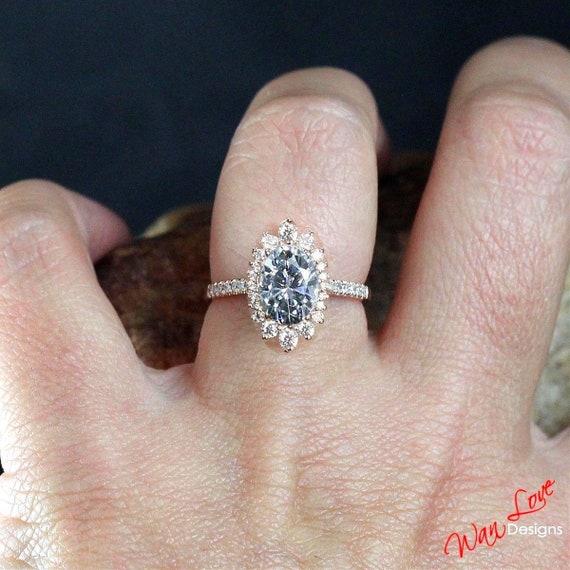 Beautiful 14K White Gold 1.35 Carat Oval Cut Moissanite with Accents Halo Ring