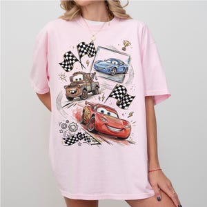 May include: A white ceramic mug with a black handle and the text "But First, Coffee" in a handwritten style. The mug is on a white surface. The mug is 4 inches tall.