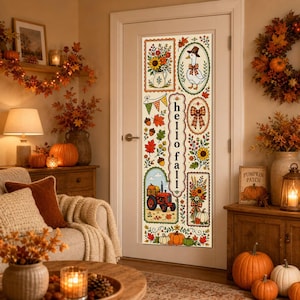 May include: A vertical door banner featuring a cream background with autumn-themed illustrations including a goose in a hat, a red tractor, sunflowers, pumpkins, acorns, and fall leaves. The text 'hello fall' is printed vertically in the center.
