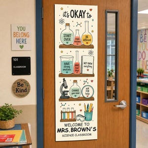 May include: A vertical rectangular sign attached to a wooden door featuring science-themed illustrations of beakers, a microscope, and test tubes. The text reads: it's OKAY to START OVER, make mistakes, BE different, HAVE strong emotions, HAVE bad days, NOT KNOW everything, CHANGE your mind, ask FOR help, WELCOME TO MRS. BROWN'S SCIENCE CLASSROOM.