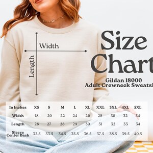 May include: A size chart for Gildan 18000 adult crewneck sweatshirts. The chart shows measurements in inches for width, length, and sleeve center back, ranging from XS to 5XL. The text "Size Chart" is displayed in large, dark letters.