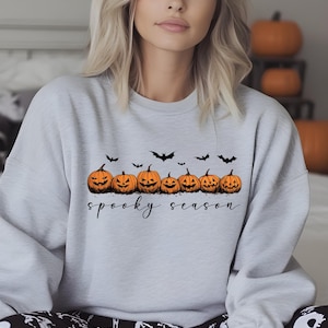 Spooky Season Sweatshirt | Cozy Halloween Crewneck | Pumpkins and Bats Graphic in Sand, Grey, White