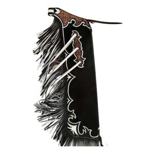 May include: Black leather chaps with white decorative trim and long fringe. The chaps feature brown leather accents and decorative stitching. A classic Western wear item.
