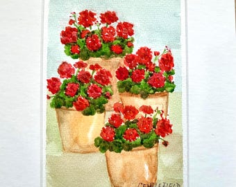 May include: A watercolor painting featuring three terracotta-colored pots filled with vibrant red geranium flowers and green leaves. The artwork is set against a light blue and green background and includes the signature CENGLEFIELD in the corner.