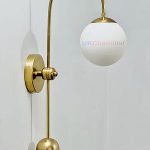 Mid-Century Modern Brass Wall Sconce: Globe Glass Shade, Handmade