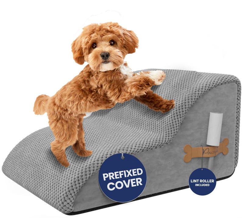 May include: A small, brown dog stands on a gray pet ramp with a textured surface. The ramp has a curved design and includes a removable lint roller. The tag reads "Prefixed Cover".