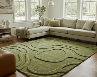 Alfombra verde con formas orgánicas de 7x10, 8x10 y 9x12, moderna y esculpida, minimalista y ondulada, inspirada en la naturaleza.