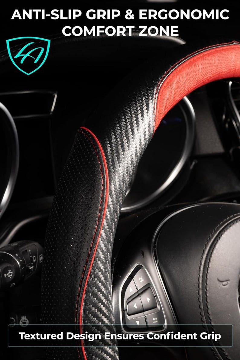 May include: Close-up of a black and red steering wheel cover with a carbon fiber texture. The cover has red stitching and a perforated grip area. Text on the image reads "ANTI-SLIP GRIP & ERGONOMIC COMFORT ZONE" and "Textured Design Ensures Confident Grip."