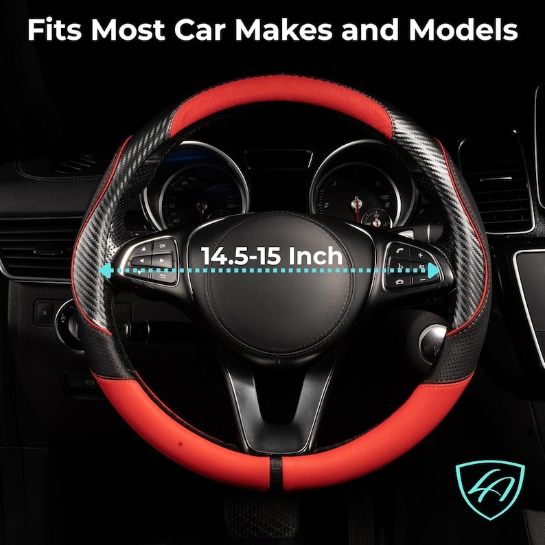 May include: A black and red steering wheel cover with a carbon fiber design. The cover fits steering wheels 14.5-15 inches in diameter. The text "Fits Most Car Makes and Models" is at the top.