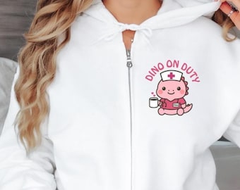 Krankenschwester Jacke, Süße Krankenschwester Jacke mit Dino, Zip Hoodie, Kaputzenjacke, Geschenk für Krankenschwester, Abschiedsgeschenk