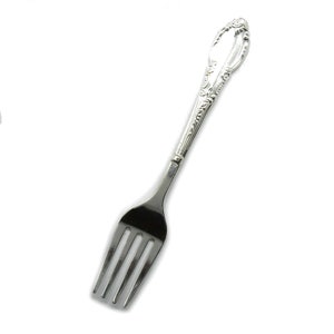May include: A silver fork with an ornate handle. The fork has four tines and a decorative design on the handle.