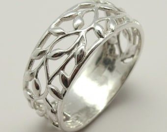 May include: A polished silver ring featuring an openwork design of interconnected leaves and vines. The band has a continuous cutout pattern that wraps around the entire circumference, creating a delicate, airy structure with a bright metallic finish.