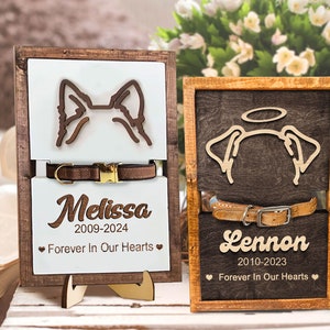 May include: Two wooden pet memorial signs with a dog silhouette, collar, and personalized text. The sign on the left says "Melissa 2009-2024 Forever In Our Hearts" and the sign on the right says "Lennon 2010-2023 Forever In Our Hearts".