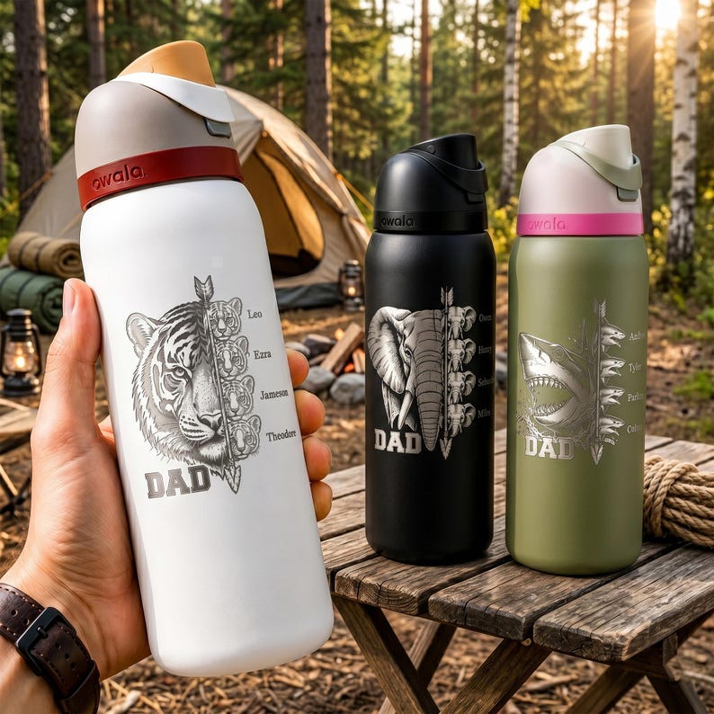May include: Three insulated water bottles with animal designs. One white bottle features a tiger, the text "DAD", and names. A black bottle has an elephant design, and a green bottle has a shark design. All bottles have a flip-top lid.