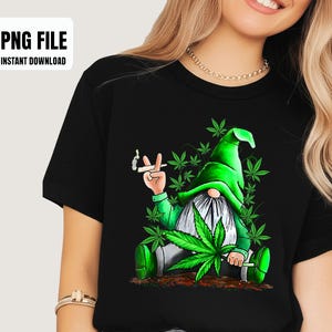 May include: Black t-shirt featuring a whimsical gnome design. The gnome, dressed in green, holds a cannabis leaf and a lit cigarette, surrounded by cannabis leaves. The text "PNG FILE INSTANT DOWNLOAD" is in the upper left corner.