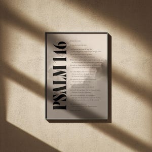 May include: A framed print featuring the text "Psalm 146" in large, bold letters on the left side. The print contains a passage of text in a serif font, set against a neutral background, suitable for home decor.