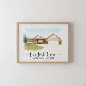May include: Watercolor painting of a house in a wooden frame. The house has a beige exterior, a garage, and a driveway. The text "Our First Home" and "The Harrisons | Est. 2025" are written in black script.