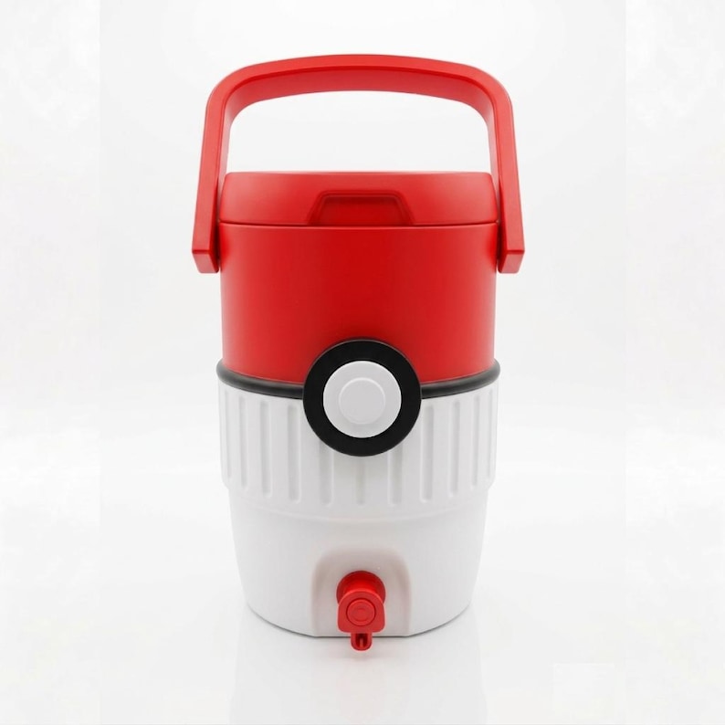 May include: Red and white water cooler with a black and white circular design. The cooler has a red handle and a red spigot. The design resembles a popular cartoon character.
