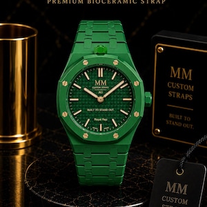 May include: A green bioceramic watch with a matching link bracelet, featuring a textured green dial, gold-tone indices, and hands. The dial displays the text MM CUSTOM STRAPS AU BUILT TO STAND OUT. Royal Rep and SWISS MADE are printed on the dial.