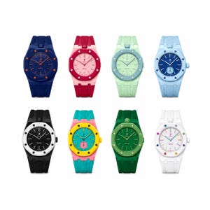 Könnte beinhalten: Acht farbenfrohe Armbanduhren mit passenden Armbändern. Die Uhren haben verschiedene Farben, darunter Blau, Rosa, Grün und Weiß. Jede Uhr hat ein rundes Zifferblatt mit kontrastierendem Zifferblatt und Zeigern. Die Armbänder sind aus flexiblem Material.