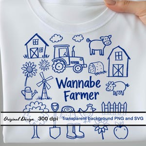 May include: White t-shirt with a blue farm-themed graphic. The design includes a tractor, barn, windmill, and the words "Wannabe Farmer." Additional elements include a cow, pig, and various farm tools.