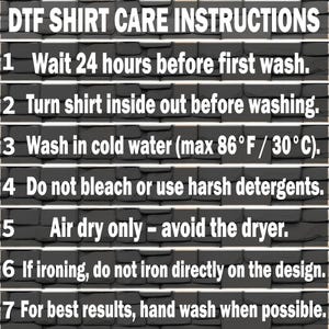May include: DTF shirt care instructions are displayed on a dark gray brick background. The text includes washing instructions: wait 24 hours before washing, turn inside out, wash in cold water (max 86&deg;F), avoid bleach, air dry, and hand wash when possible.