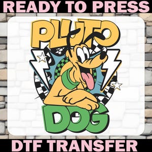 May include: A DTF transfer featuring Pluto the dog with the text "PLUTO DOG" in yellow and green. The design includes lightning bolts, stars, and a checkered pattern, with the words "READY TO PRESS" and "DTF TRANSFER" in pink.