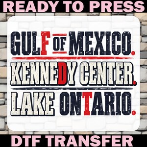 May include: A rectangular DTF transfer sheet featuring the text READY TO PRESS at the top and DTF TRANSFER at the bottom. The center displays the words GULF OF MEXICO, KENNEDY CENTER, and LAKE ONTARIO in a distressed navy blue font with red accents.