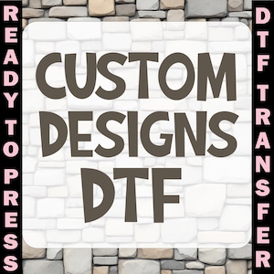 May include: A square graphic with the words "CUSTOM DESIGNS DTF" in brown, set against a white stone background. The words "READY TO PRESS" and "DTF TRANSFER" are vertically aligned on the left and right sides, respectively.